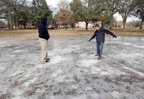 Ben Sigmon, left, and Joshua Moon, both students at the University of Alabama, explored ice on campus.
