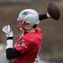 Tom Brady shows a healthy right shoulder in Thursday’s practice. (Barry Chin/Globe Staff)