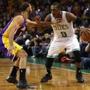 Rajon Rondo drove around Lakers point guard Kendall Marshall on Friday at TD Garden in his first game in nearly a year. 