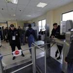 Security guards checked visitors at the entrance to the Olympic park in Adler near Sochi last week. In light of recent threats, President Vladimir Putin has said Russian security officials are prepared for the start of the Games on Feb. 7.