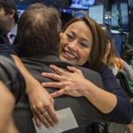Care.com CEO Sheila Lirio Marcelo embraced a colleague at the firm’s initial public offering on the New York Stock Exchange.
