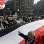 Egyptians carried a giant banner during a rally in Cairo’s Tahrir Square on Saturday.