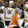 Zdeno Chara, center, celebrated his power play goal with Torey Krug, left, and Jarome Iginla, right. (AP Photo/)