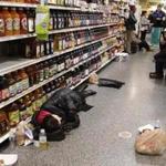  TAMI CHAPPELL/REUTERS People slept in the aisle of an Atlanta grocery store Wednesday after being stranded in the storm.