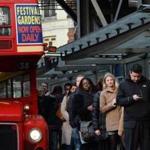 Commuters waited for a bus at Victoria Station in London as unions went on a 48-hour strike over plans to cut 950 jobs.  