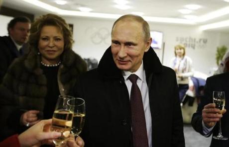  Putin toasts guests in the presidential lounge after the ceremony.
