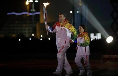 Former hockey player Vladislav Tretiak (left) and former figure skater Irina Rodnina lit the Olympic Cauldron.
