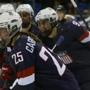 North Reading native Alex Carpenter (left) of Team USA celebrated after scoring a goal Saturday in the Americans’ 3-1 defeat of Finland.