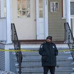 Police investigated the fatal shooting of a boy at the three-decker on Morton Street in Mattapan.