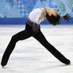 Yuzuru Hanyu of Japan bent over backward to win the gold medal in men’s figure skating. (AP Photo/The Canadian Press, Paul Chiasson)