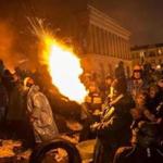 Antigovernment protesters used a compressed-air cannon to launch a Molotov cocktail toward police at Independence Square in Kiev on Wednesday.