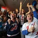 Katelyn Duggan (center), the sister of US team captain Meghan Duggan, reacted with despair Thursday as the team lost 3-2 in overtime to Canada. Family and friends gathered at a pub.