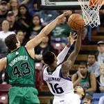 The Celtics’ Kris Humphries is too late to stop Ben McLemore’s driving layup for the Kings.