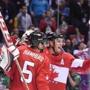 Canadian players celebrated after winning the gold medal game against Sweden.