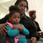 Garrett Waite, Naromi Occeus, and their four-year-old daughter, Preshiox-G'Ani Waite, listened to speakers at the Massachusetts State House. They were homeless and living in a shelter for 27 months, and just recently received a voucher to live in their own home. 