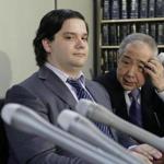 Mark Karpeles (left), CEO of Tokyo-based troubled bitcoin exchange Mt. Gox, said Friday the exchange was filing for bankruptcy.