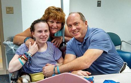 Justina Pelletier (left) with her parents, Linda and Lou Pelletier, at Boston Children's Hospital last year.
