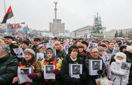 Ukrainians held portraits of people killed during protests in Kiev’s Independence Square on Sunday.
