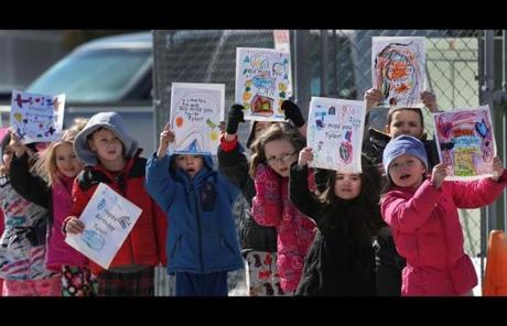 Students at Burrillville’s Austin T. Levy Elmentry School lined the street as the convoy passed, with well-wishes for their classmate Tyler.

