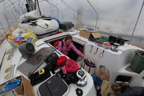 Sarah Garant and her family live year-round on their sailboat, which is covered in plastic during the cold months
