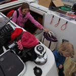 Sarah Garant and her family live year-round on their sailboat, which is covered in plastic during the cold months