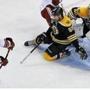 Bruins defenseman Johnny Boychuk lost his stick, but it did not stop him from helping to protect goalie Tuukka Rask from a shot by the Coyotes Oliver Ekman-Larsson in the second period. 
