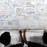  At Kuala Lumpur International Airport on Thursday, some well-wishers hung a sign with prayers for the 239 people on the missing Malaysia Airlines Flight MH370. Six days after the plane disappeared, Malaysian authorities expanded their search area.