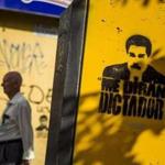 View of a graffiti with the image of President Nicolas Maduro and a message that reads “They will call me dictator,” painted on a wall in Caracas, Venezuela.
