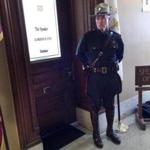 A Rhode Island state trooper stood outside the office of House Speaker Gordon Fox on Friday.