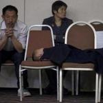 Relatives of passengers aboard the missing plane waited for news at a hotel room in Beijing.