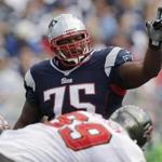 Vince Wilfork is balking at a pay cut, which has him and the team at a standoff. (Photo by Winslow Townson/Getty Images)
