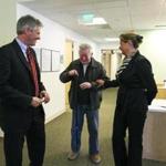 Scott Brown and wife, Gail Huff, stopped to talk with hospital visitor John Hogan of Freedom, N,H, while touring Frisbie Memorial Hospital in Rochester, N.H., on Tuesday.