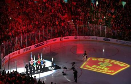 A tribute to the two fallen firefighters took place on the ice before Thursday's Bruins game at TD Garden.
