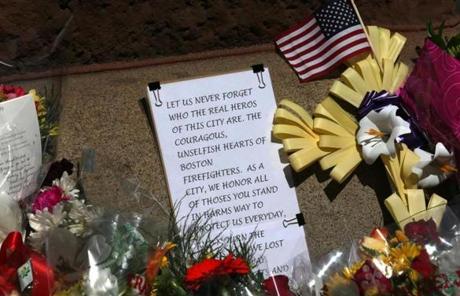 Flowers and notes were left outside the fire station.
