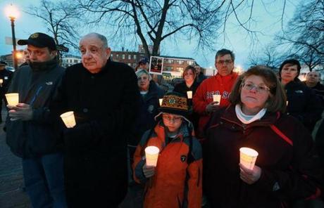 A candlelight vigil was held in East Boston's Central Square.
