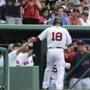 Shane Victorino (18) is greeted at the dugout after he scored in the third inning Saturday. Gerald Herbert/AP
