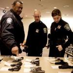 Boston Police Chief William Gross, officer James Kenneally, and officer Rachel McGuire examined guns from the buyback.