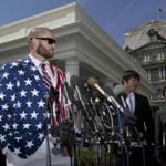 Boston Red Sox outfielder Jonny Gomes (left) spoke to reporters April 1 in front of the West Wing of the White House in Washington, D.C., following a ceremony where President Barack Obama honored the 2013 World Series baseball champion the Boston Red Sox on the White House South Lawn.