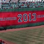One by one, banners commemorating the 2004, 2007, and 2013 championships were unfurled on the Green Monster.
