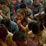 Relatives of those on board the missing plane cried in a prayer room in Beijing on Friday.