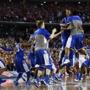 The Wildcats celebrated their 74-73 win over the Badgers to advance to Monday’s championship game.