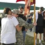 A Fort Hood soldier (at right in foreground)  hugged Specialist Kristen Haley, the fiancee of one of the people killed in the Fort Hood shooting, at a tribute walk for victims in Killeen, Texas, on Friday.