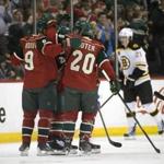 The Minnesota Wild celebrate a goal by forward Jason Pominville (29) in the first period against the Bruins at Xcel Energy Center. 