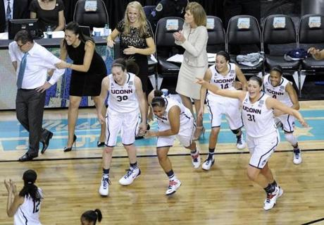 UConn players and coaches celebrated at the end of the game.
