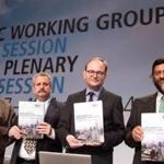 Members of UN climate panel held copies of their report.