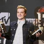 Actor Josh Hutcherson posed with his awards for Best Male Performance and Best Movie of the Year for “The Hunger Games: Catching Fire” at this year’s MTV Movie Awards.