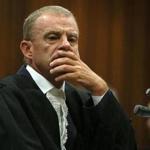 “Who should we blame for the fact that you shot her?’’ prosecutor Gerrie Nel (pictured) asked Pistorius.