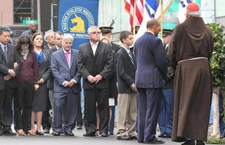 The brief ceremony was held at the bombing sites on Boylston Street.
