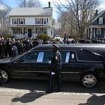 Boston Police officers walked along side hearse carrying the body of Boston Police Officer Dennis Simmonds down North Main Street in Randolph . 