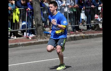 Henry Richard, the brother of Marathon victim Martin Richard, participated in BAA Youth 2014 Relay Races on Boylsyon Street. 
